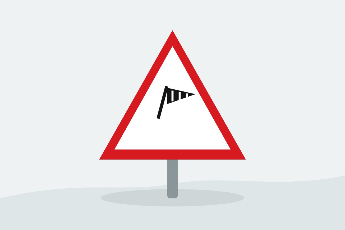 Eigenständig gezeichnetes Verkehrszeichen mit einem roten Dreieck und einem schwarzen Windsack.