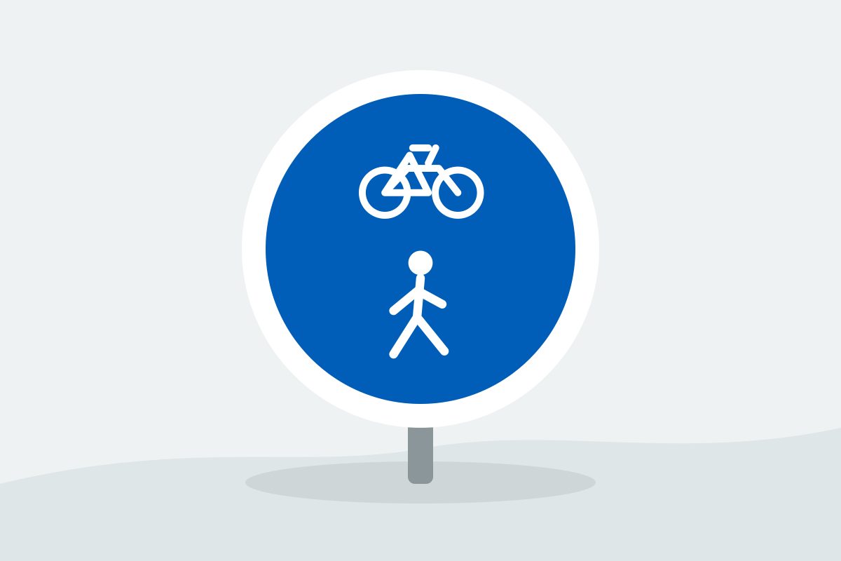 Eigenständig gezeichnetes Verkehrszeichen mit einem blauen Kreis mit weißem Fahrrad und weißer Person übereinander.